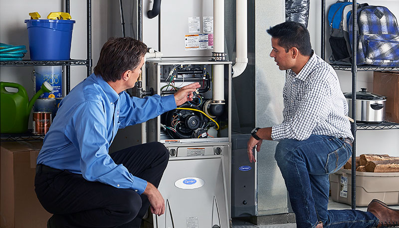 HVAC technician evaluating a furnace for repair or replacement in American Fork